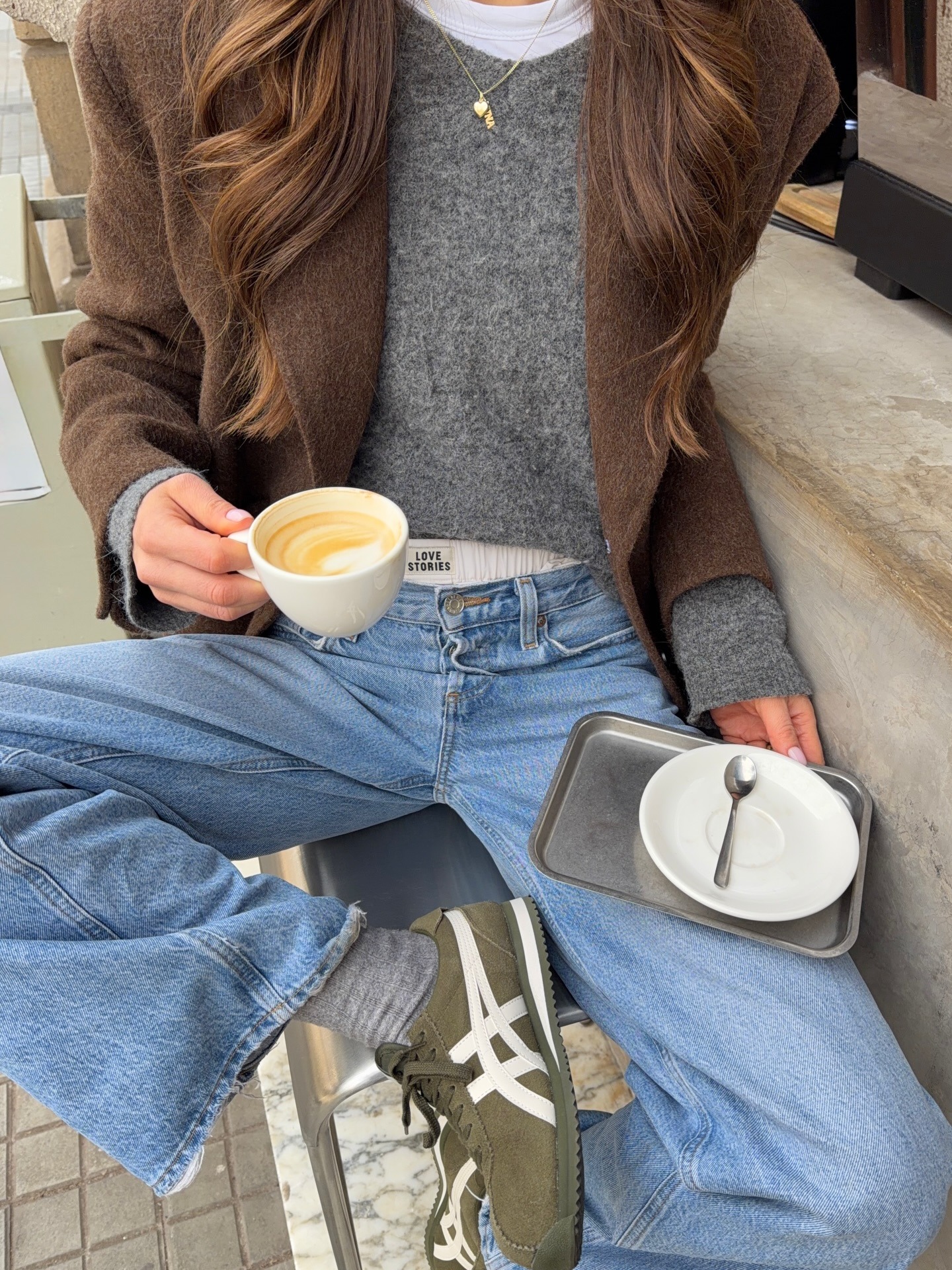 Woman in a sweater jeans with undies showing