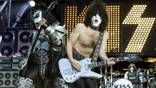 Kiss frontman Paul Stanley on stage with his Ibanez PS1 guitar