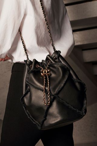Chanel bucket bag carried by model