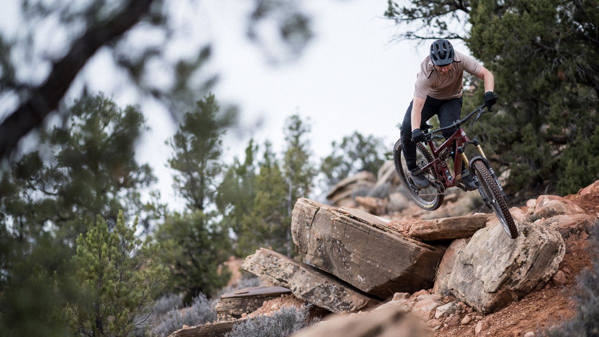 New Yeti SB135 bike being jumped over rocks