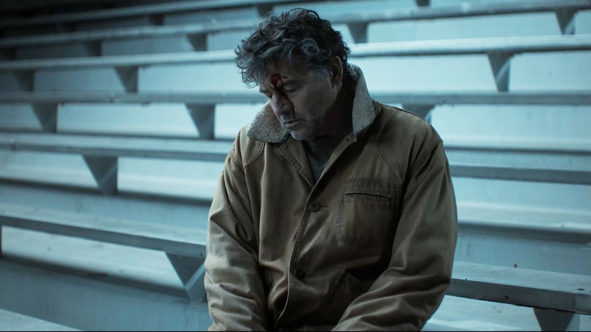 A slumped and dead Hal Jordan sitting down in the Lanterns season 1 finale