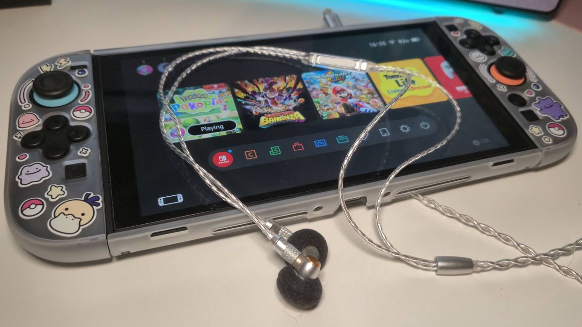 Photo of the SIVGA M260 wired earbuds sitting on a Switch 2.