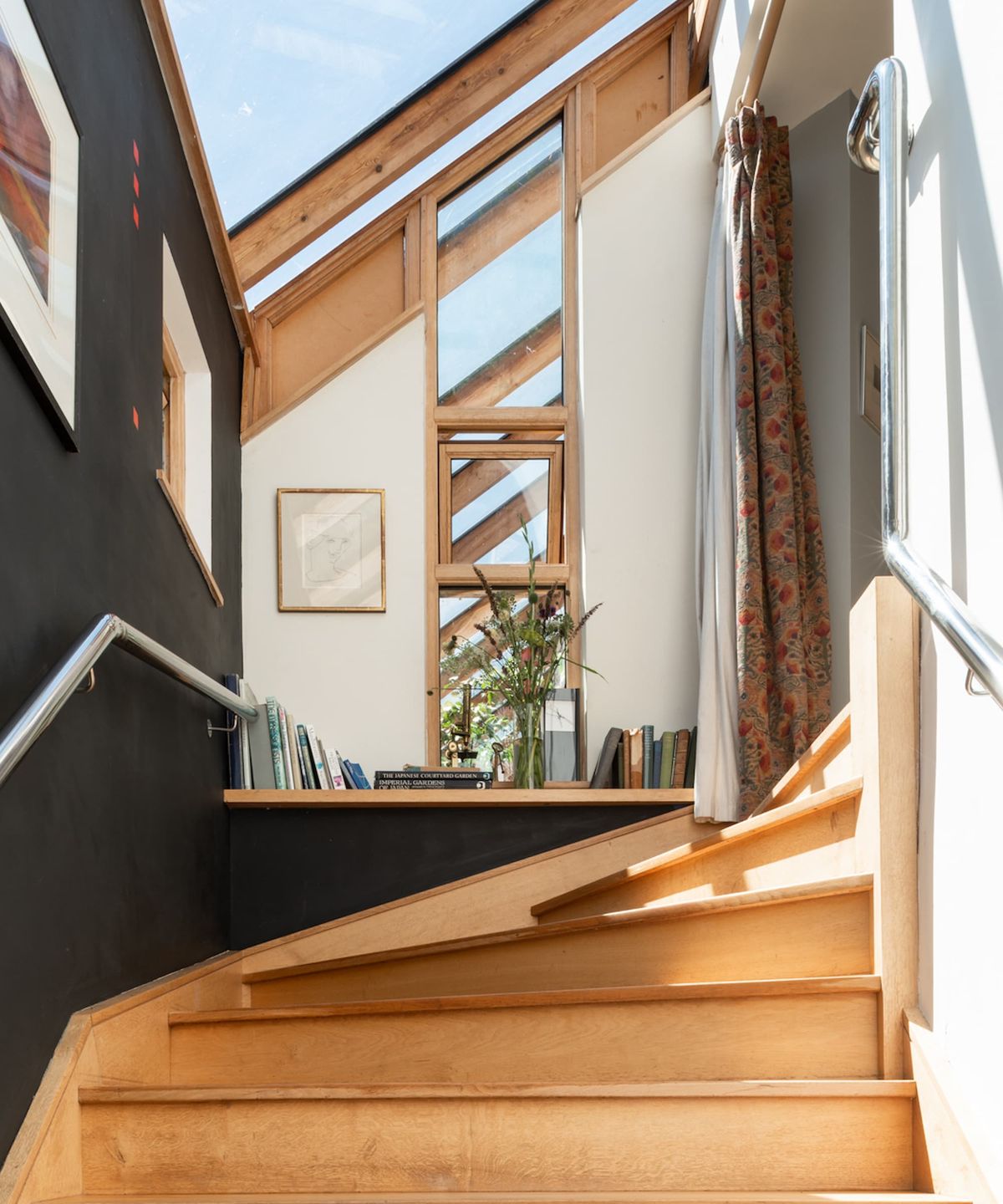 A wooden staircase that wraps round the corner