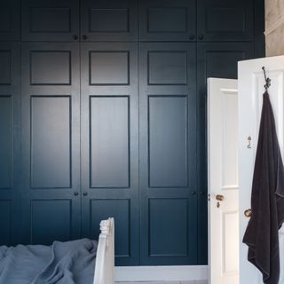 Anthracite grey built-in wardrobes in a bedroom