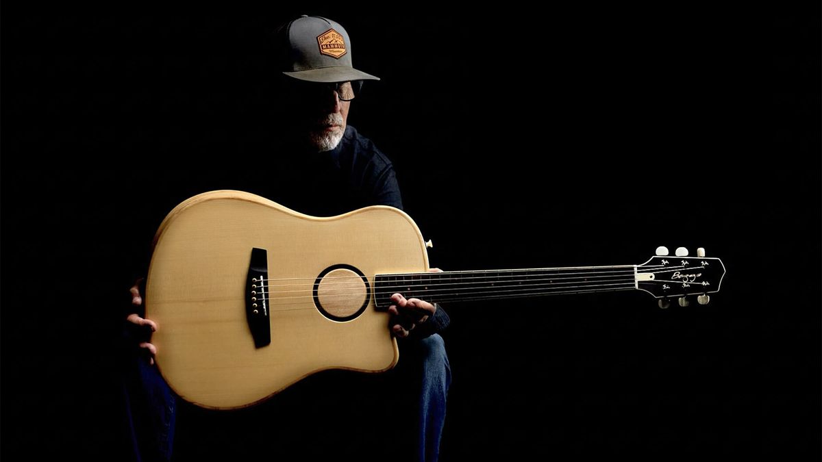 Lloyd Baggs holding an AEG-1 acoustic-electric guitar