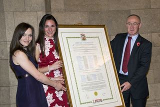 Victoria Pendleton and Sarah Storey collect the honour from Sir Richard Leese, Leader of Manchester City Council