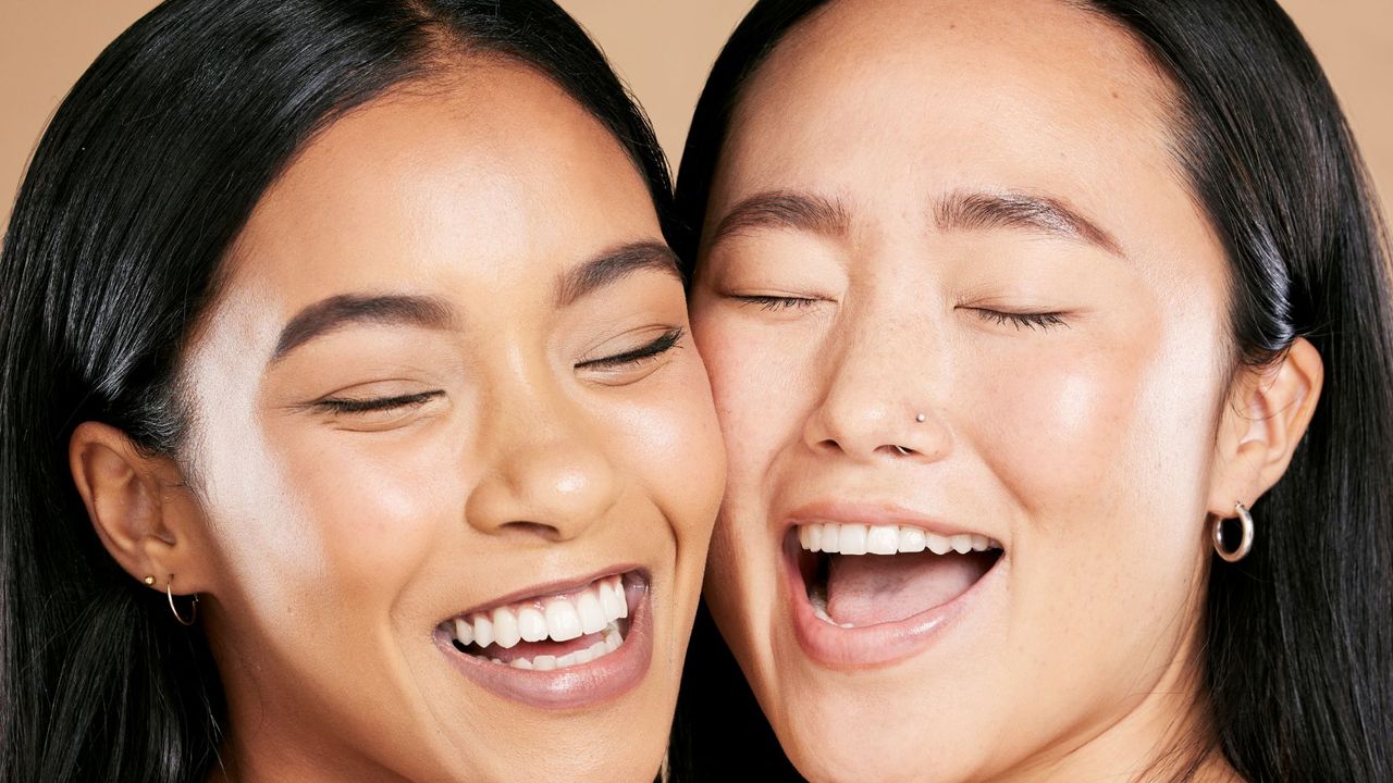 two models laughing together - best drugstore foundation