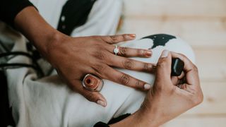 A woman painting her nails