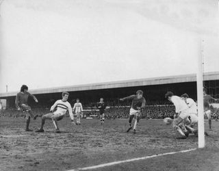 George Best about to score his third goal (of six) for Manchester United during their Fifth Round FA Cup match against Fourth Division Northampton Town. United won the match with a final score of 8-2.