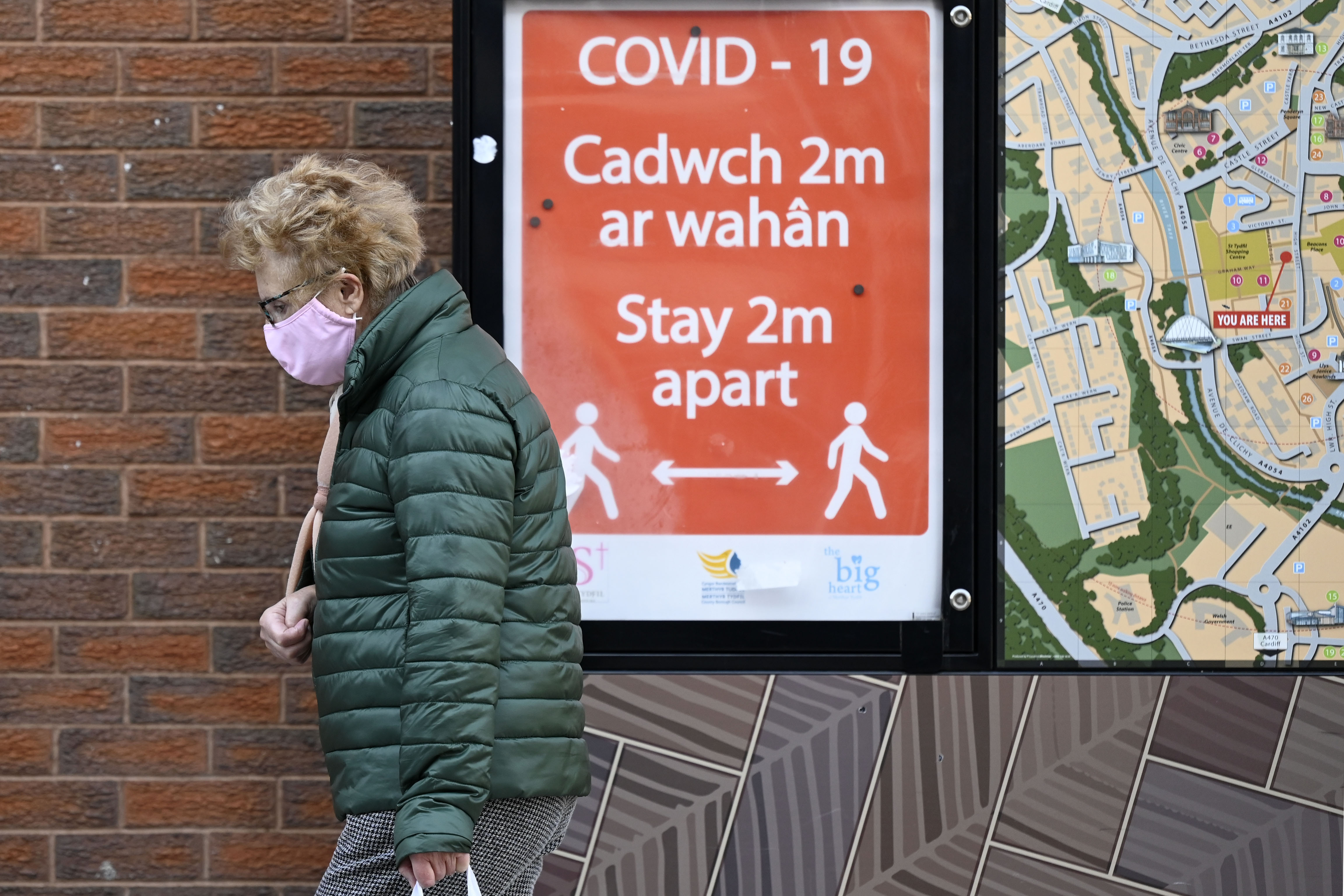 Woman wearing face mask during the circuit breaker lockdown in Wales last year