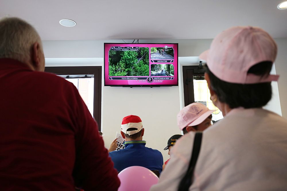 The Tifosi watch the stage in a bar