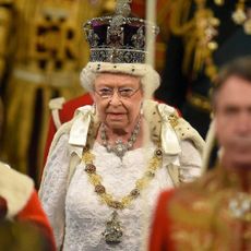  Queen Elizabeth proceeds through the Royal Gallery during the State Opening of Parliament in central London on May 18, 2016. 