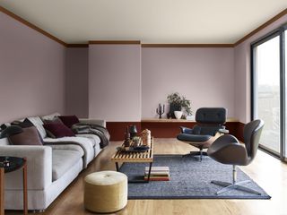 A living room painted purple