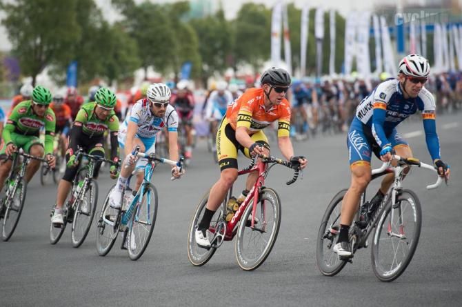 The peloton race towards the finish of the final stage of the Tour of Taihu Lake