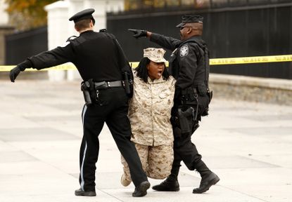 A military veteran is arrested during a protest against “Don’t Ask Don’t Tell” in 2010.