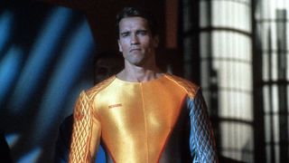 Arnolds Schwarzenegger stands in a yellow and green leotard in The Running Man