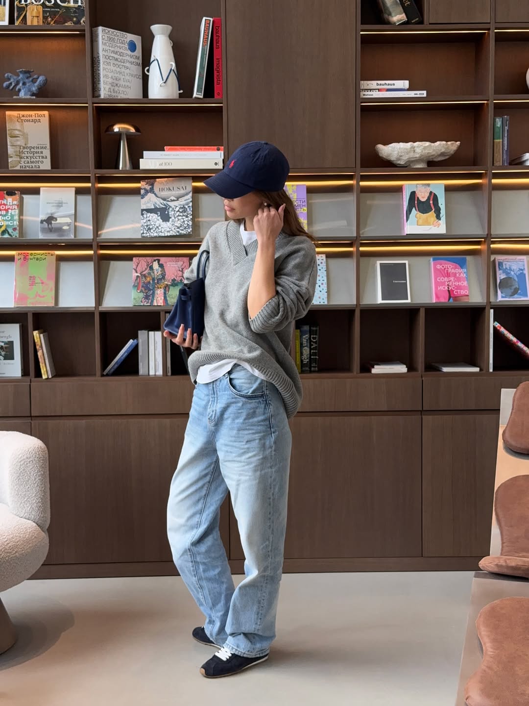 woman wearing gray sweater spring outfit 2026