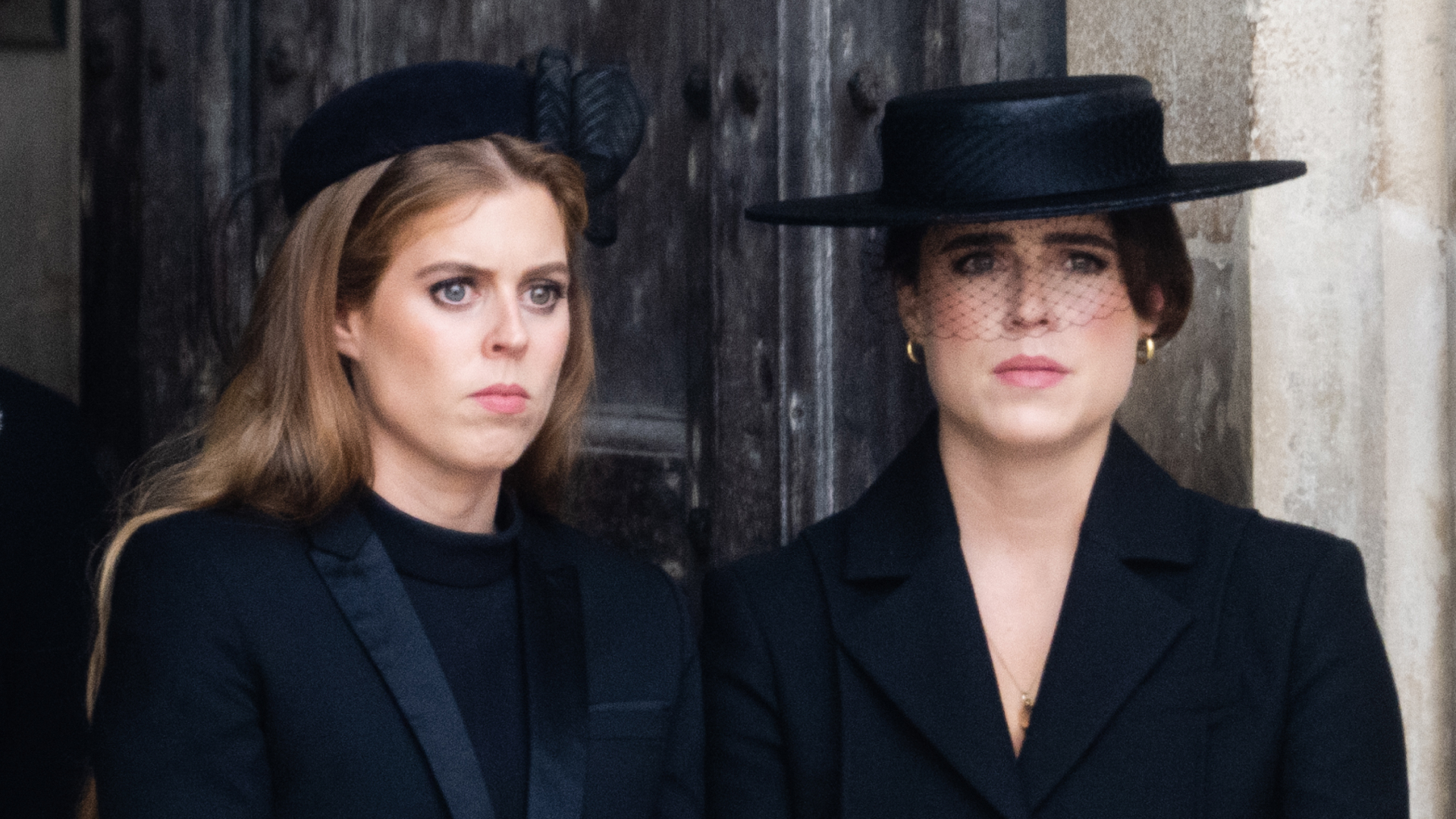 Princess Beatrice and Princess Eugenie both look sad while wearing black outfits