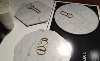Metal bottle openers on marble mats
