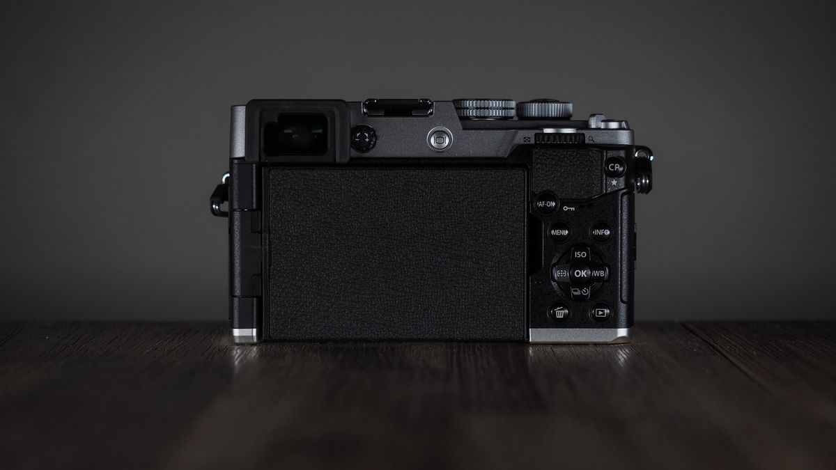 OM System OM-3 on a wooden surface