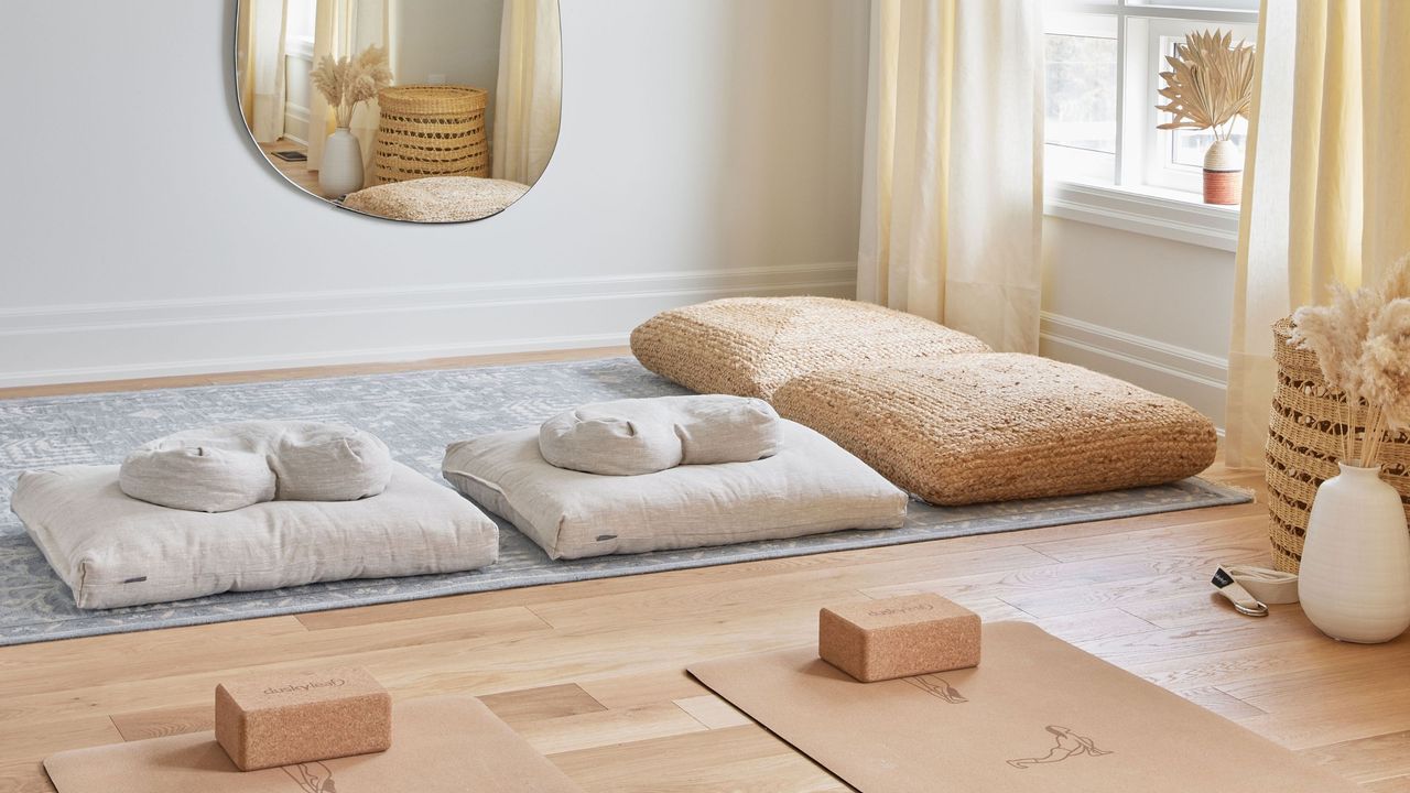 wellness room at home with yoga mats and pillows