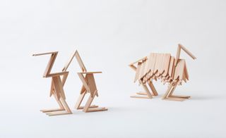 Display of two wooden building block creations.