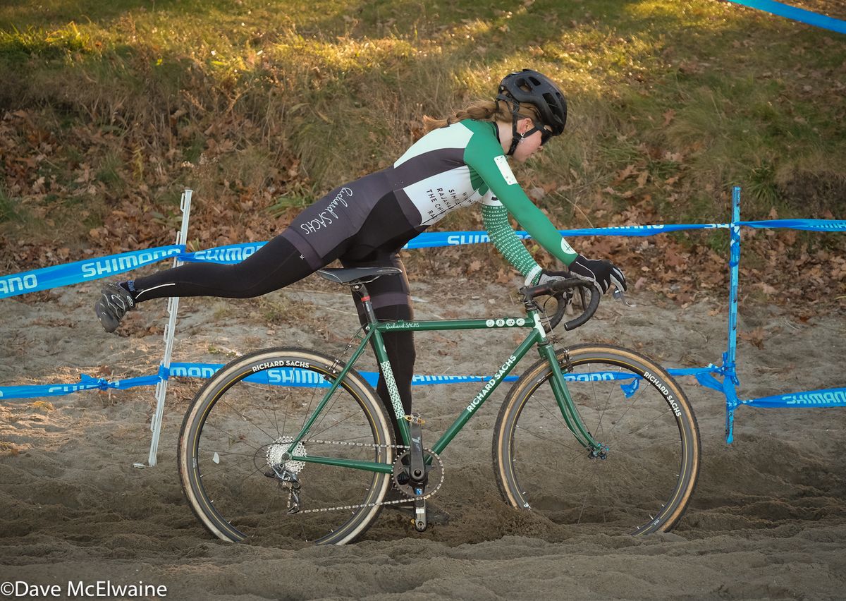 Libby White (House Industries) dismounting in the sand at the beach.