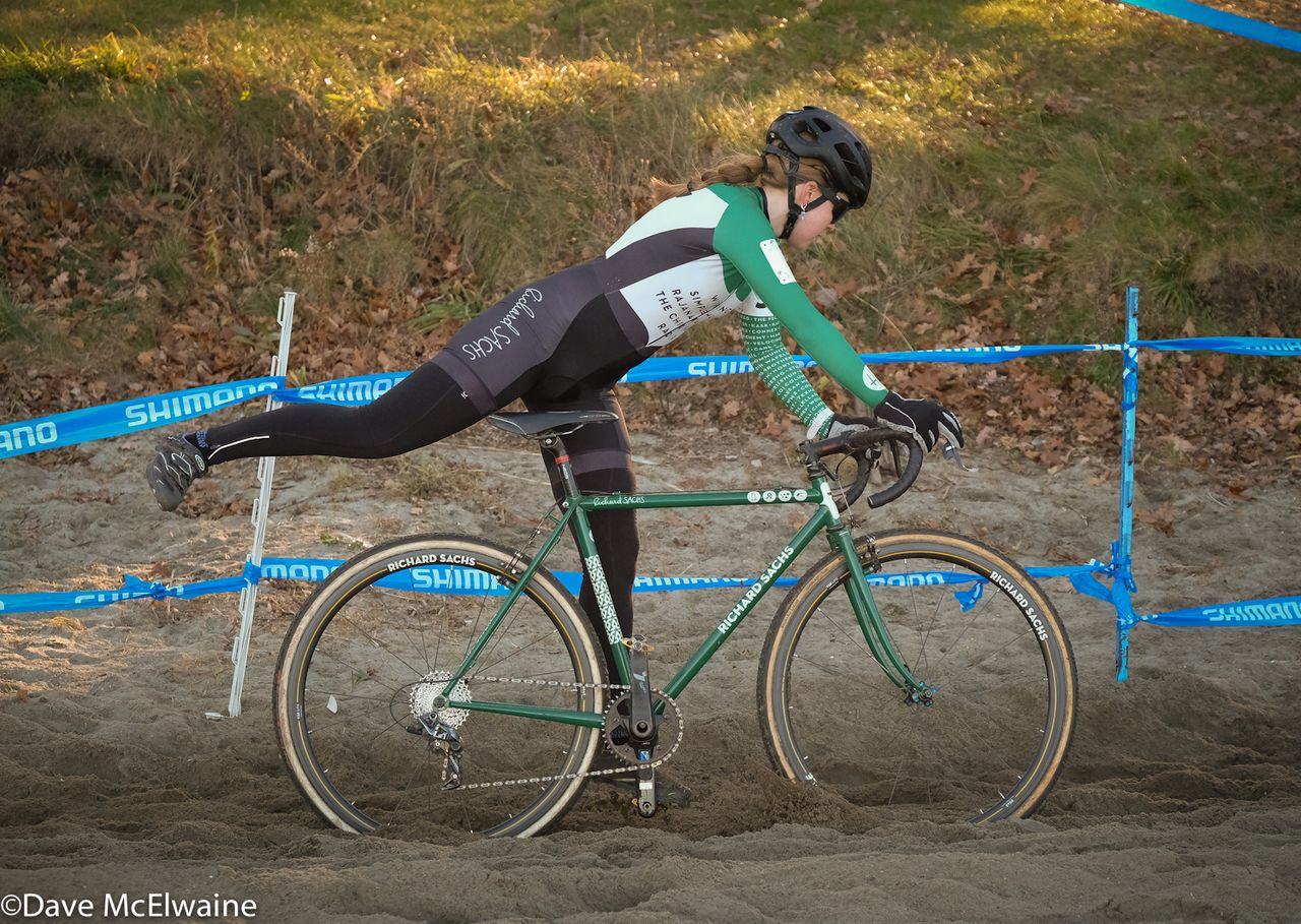 Libby White (House Industries) dismounting in the sand at the beach.
