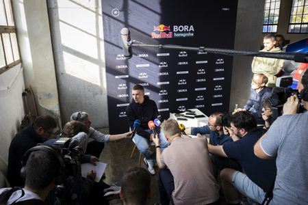 Red Bull–Bora–Hansgrohe’s Belgium rider Remco Evenepoel speaks to journalists during a press conference in the media day of their new team in Binissalem on Mallorca Island on December 10, 2025. (Photo by Jaime REINA / AFP)