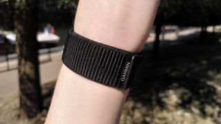 Woman's wrist wearing Garmin Enduro 2 UltraFit band