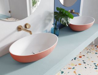 pastel pattern tiles and pink sink in bathroom