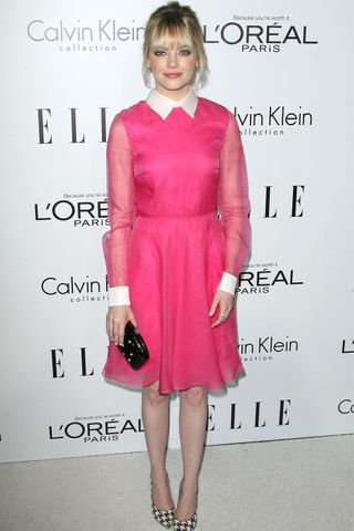 Emma Stone is prim in a pink dress with a Peter Pan collar