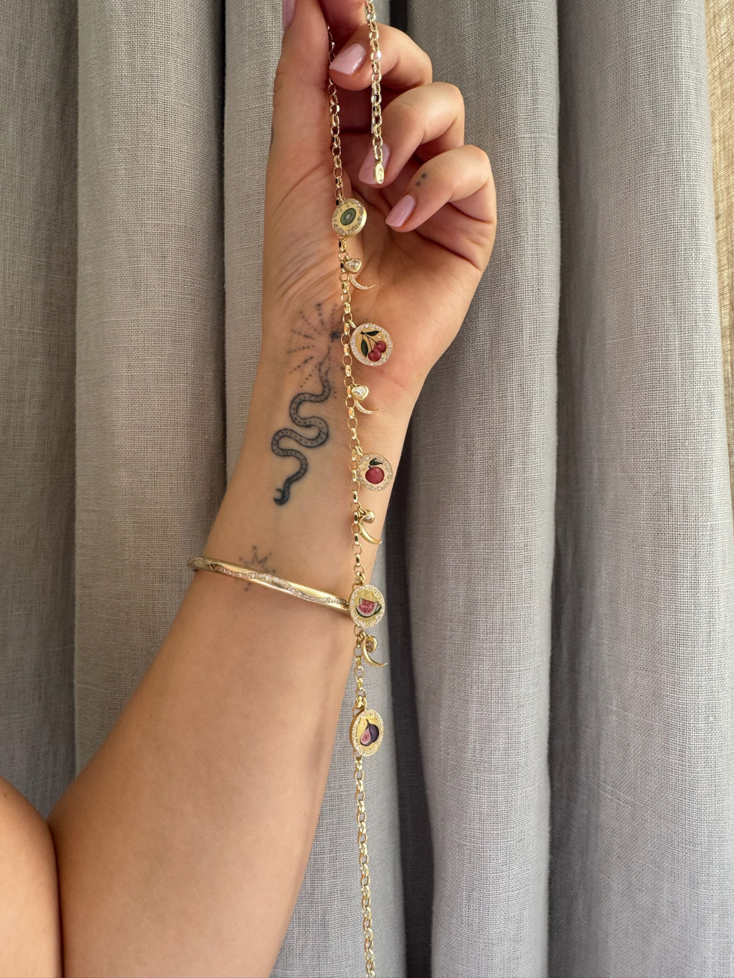 Cece Fein-Hughes's snake tattoo