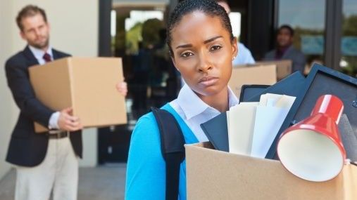 Woman leaving office after being fired