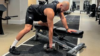 Calum Sharma, personal trainer at the Bodylab, demonstrates the starting position of a dumbbell row