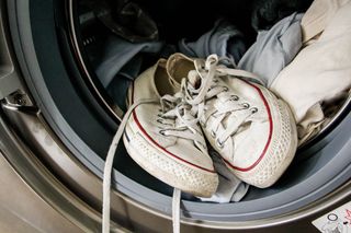 A pair of white shoes in a washing machine