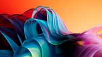 Abstract image that looks like tulle ribbons bunched up together. The ribbons are blended shades of green, blue, and purple. The background is an ombre orange to yellow. 