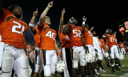 University of Miami Hurricanes salute their fans after a 2007 loss: The team is embroiled in allegations of an eight-year NCAA rule-breaking run.