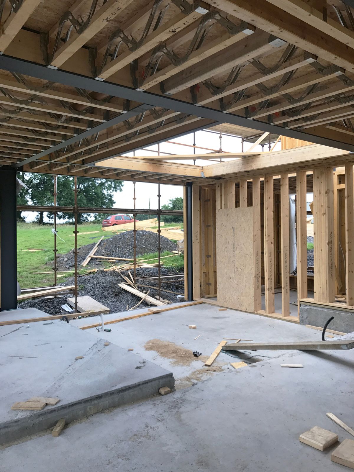 The interior of a house under construction with a light well in the centre