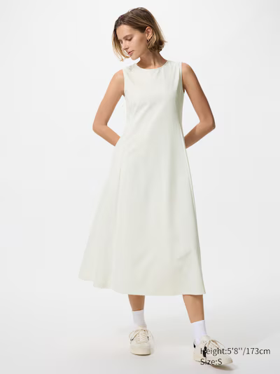 A model wearing a Uniqlo white dress.