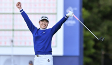 Rio Takeda celebrates after holing the winning putt on the green