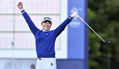 Rio Takeda celebrates after holing the winning putt on the green