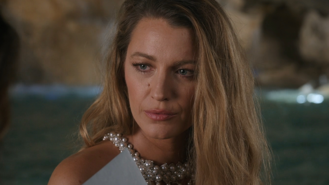 A worried looking Blake Lively is presented with a note in Another Simple Favor.
