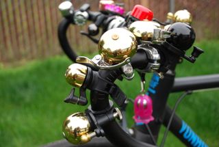 A selection of the best bike bells mounted on a set of handlebars