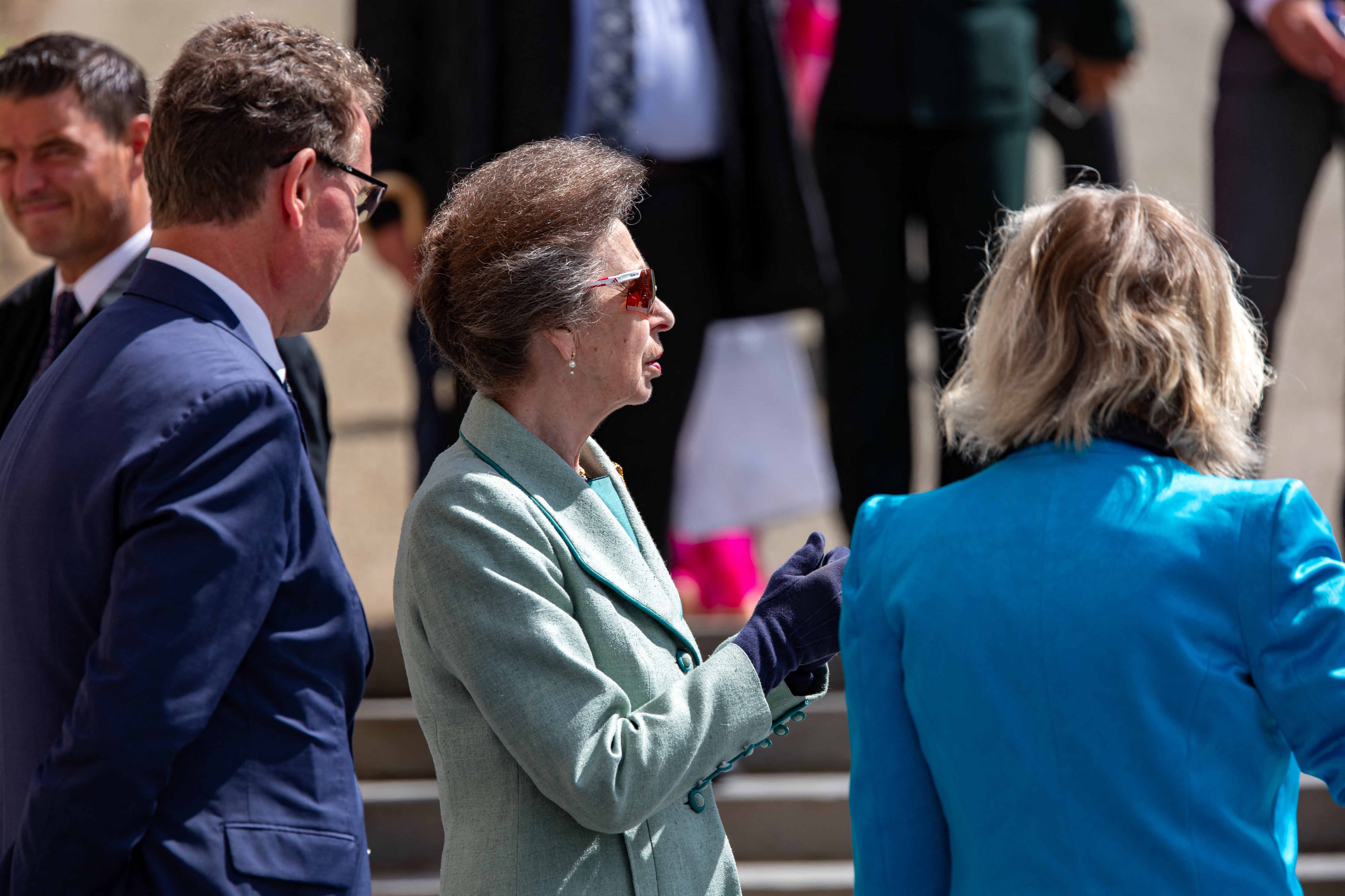 Princess Anne wearing a mint green coat and sunglasses