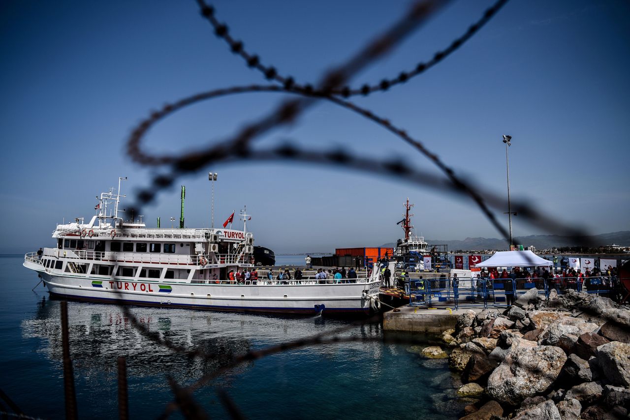 Migrants prepare to take a boat from Greece to Turkey.