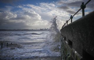 The wind whips up the sea and creates a looming sky on New Brighton promenade, as the UK readies for the arrival of Storm Barra