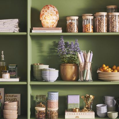 Sostrene Gren home decor items on green shelving.