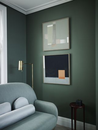 green living room with art by Gunter & Co