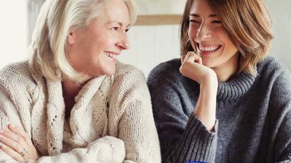 A mom and a daughter sitting together